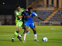 Colchesters Kwame Poku  and Forest Greens Vdoka Godwin-Malife battle for the ball during the Sky Bet League 2 match between Colchester Unite...