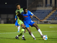 Colchesters Kwame Poku and Forest Greens Vdoka Godwin-Malife battle for the ball during the Sky Bet League 2 match between Colchester United...