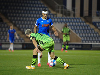 Colchesters Cohen Bramall held up by Forest Greens Josh March during the Sky Bet League 2 match between Colchester United and Forest Green R...
