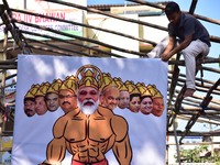 Members of National Students Union of India (NSUI)  perform holy ritual by making prime minister of India Narendra Modi ten heads like Ravan...