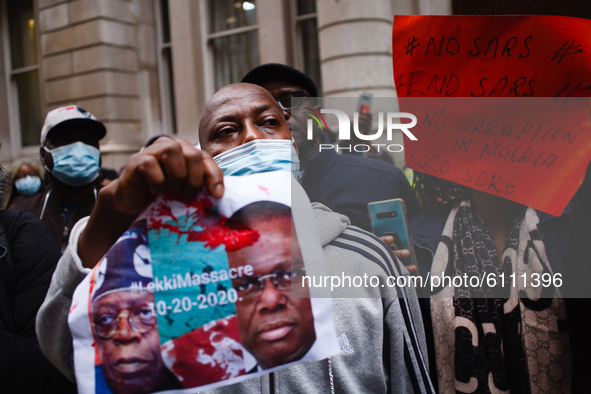 Activists protesting police brutality by the Nigerian Special Anti-Robbery Squad (SARS) demonstrate outside the Nigerian High Commission on...