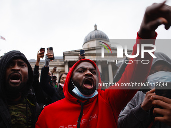 Activists protesting police brutality by the Nigerian Special Anti-Robbery Squad (SARS) demonstrate in Trafalgar Square in London, England,...