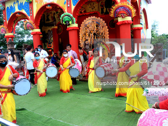 Traditional drummers play perform near an idol of the ten-armed Hindu Goddess Durga at the virtual inauguration of Bharatiya Janta Party cul...
