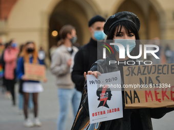 Pro-Choice activist holds a placard saying 'You Condemn Us To Suffering' during a Pro-Choice protest in Krakow's Market Square on Wednesday,...