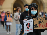 Pro-Choice activist holds a placard saying 'You Condemn Us To Suffering' during a Pro-Choice protest in Krakow's Market Square on Wednesday,...