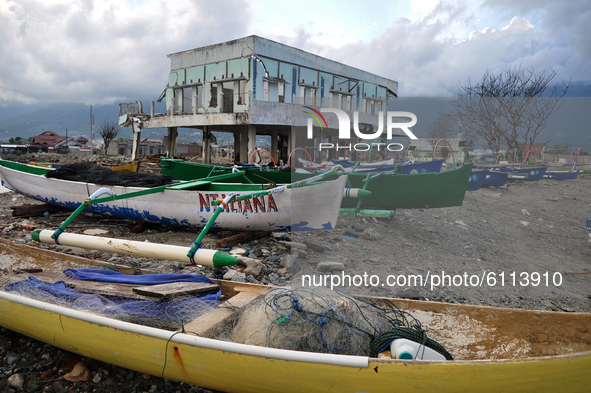 A fisherman's boat is parked off the coast of Besusu Village, Palu City, Central Sulawesi, because it cannot carry out fishing activities af...