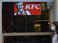 A lady walks by a KFC restaurant in Krakow's center.
As per 'Rzeczpospolita', a nationwide economic and legal journal on-line, according to...