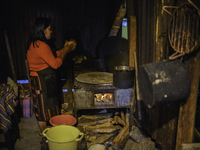 Margarita Sulan makes tortillas for dinner at her home in Sumpango Sacatepequez 60 kilometers west of Guatemala City on Thursday, October 22...