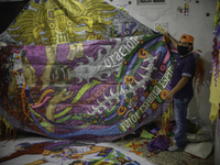 Farmer Florentin Sulan shows a giant kite in Sumpango Sacatepequez, 60 kilometers west of Guatemala City, on Thursday, October 22, 2020. The...
