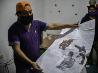 Farmer Florentin Sulan shows the design of the Giant Kite in Sumpango Sacatepequez, 60 kilometers west of Guatemala City, on Thursday, Octob...