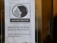 A sign 'Wear Mask' at the entrance to a shop in Krakow's center.
Polish Prime Minister Mateusz Morawiecki today announced a series of strict...