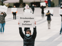 a protester holds a placard 