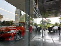 Visitors see new vehicle in ''BMW On Tour at BMW Thamrin dealership, Jakarta, on , October, 24, 2020. BMW Indonesia held a sales program dur...