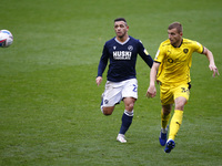  L-R Mason Bennett of Millwall and Michal Helik of Barnsley during Sky Bet Championship between Millwall and of Barnsley at The Den Stadium,...