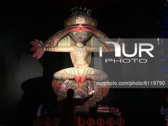 Hindu goddess durga idol at a community a temporary structure to perform during the Hindu festival 'Durga Puja' celebrations, in Kolkata on...