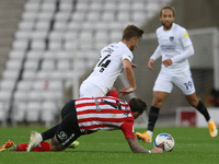    Michael Jacobs of Portsmouth is challenged by Chris Maguire of Sunderland during the Sky Bet League 1 match between Sunderland and Portsm...