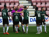 Plymouth players surround linesman & ref after Wigans Lee Evans goal is disallowed  during the Sky Bet League 1 match between Wigan Athletic...