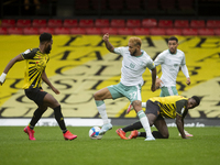 Joshua King of Bournemouth wins the tackle from Jeremy Ngakia of Watford    during the Sky Bet Championship match between Watford and Bourne...