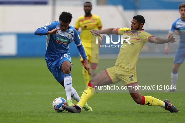 Dior Angus of Barrow in action with Walsall's Zak Jules during the Sky Bet League 2 match between Barrow and Walsall at the Holker Street, B...