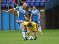 Jason Taylor of Barrow battles for possession with Walsall's Alfie Bates during the Sky Bet League 2 match between Barrow and Walsall at the...