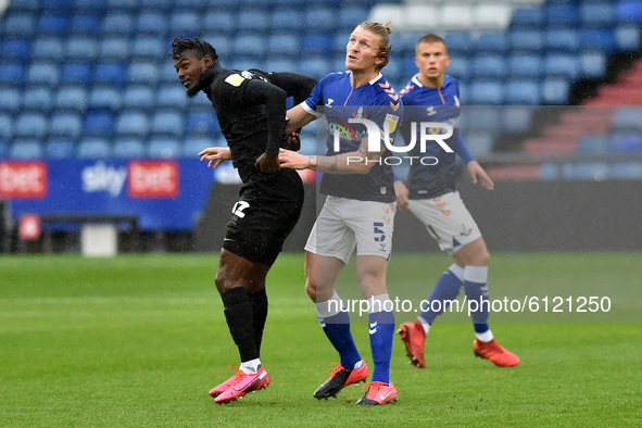 Oldham Athletic's Carl Piergianni and Port Vale's Theo Robinson in action during the Sky Bet League 2 match between Oldham Athletic and Port...