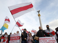 People attend a rally of solidarity with Belarusian protests on Independence Square in Kyiv, Ukraine on 25 October 2020. Belarusians who liv...