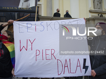 Pro-choice supporters hold a placard during a protest in front of the Holy Cross church on October 25, 2020 in Warsaw, Poland. Several thous...