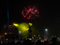 People celebrate the approval of a new constitution in Plaza Italia, an iconic place for protests and celebrations in Santiago, Chile on Oct...