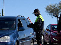 Local police control people's movement in a traffic checkpoint, under partial lockdown, in the town of Majadahonda, Madrid on 26th October,...