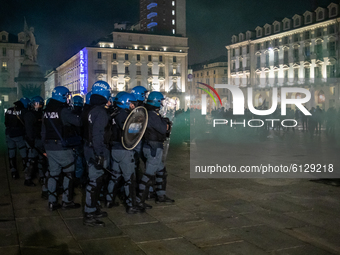 Demonstrators clash with Riot Police during the protest against the lockdown in Piazza Castello on October 26, 2020 in Turin, Italy. The pro...