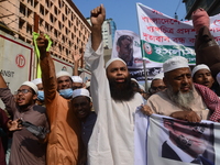 Activists of Islamist political party alliance hold banners during a demonstration calling for the boycott of French products and denouncing...