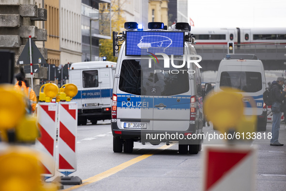 A police wagon with a led monitor showing a face mask is seen during a demonstration under the motto Alarmstufe Rot (Alarm level red) during...