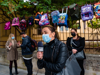 A mother interviewed by journalists in front of the Poli Middle School in Molfetta, for the parents' protest for the closure of schools on O...