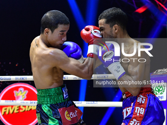 Wanchana Meenayothin of Thailand (red) punches Omar Elquers of Morocco during the WBC Asia Super Featherweight (130 LBS.) title bout at Rang...