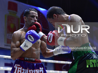 Wanchana Meenayothin of Thailand (red) punches Omar Elquers of Morocco during the WBC Asia Super Featherweight (130 LBS.) title bout at Rang...