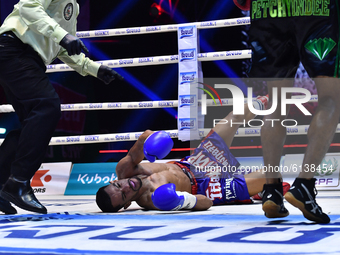 Wanchana Meenayothin of Thailand (red) knockdown of Omar Elquers of Morocco (blue) during the WBC Asia Super Featherweight (130 LBS.) title...