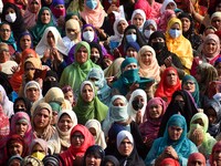 Kashmiri muslim women pray on the occasion of celebration of Mawlid-un-Nabi or Prophet Muhammad's (PBUH) birth anniversary in Dargah Hazratb...