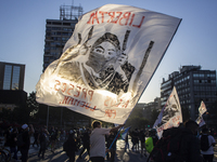 A person holds a flag with an image allusive to the freedom of prisoners on October 30, 2020 in Santiago de Chile, Chile. 
Amid of the demo...