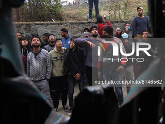 People gather outside the house where the enconter took place in Rangreth area of Srinagar outskirts, India on November 01, 2020. Inspector...