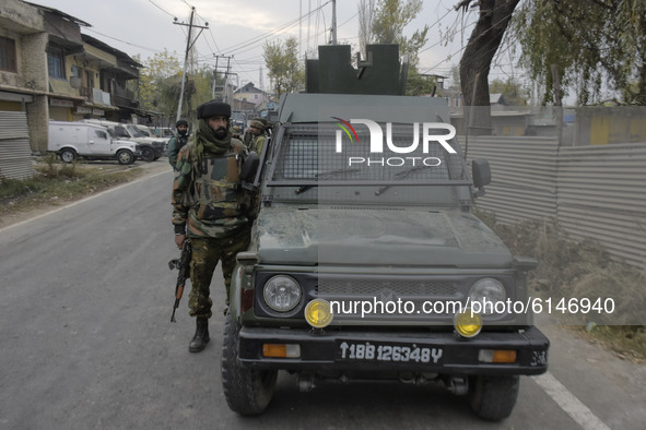 An Indian tropper stands near encounter site in Rangreth area on the outskirts of Srinagar, Kashmir on 01 November 2020. Top millitant comma...