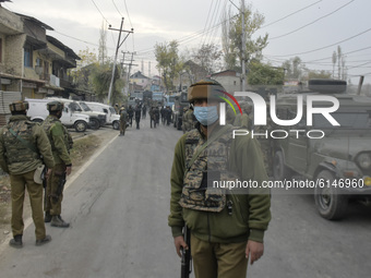 An Indian policeman stands near encounter site in Rangreth area on the outskirts of Srinagar, Kashmir on 01 November 2020. Top millitant com...