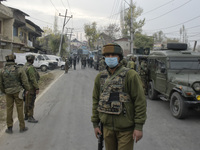 An Indian policeman stands near encounter site in Rangreth area on the outskirts of Srinagar, Kashmir on 01 November 2020. Top millitant com...
