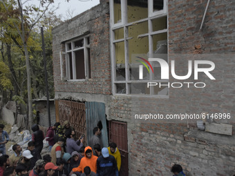 Kashmiri people asess damage of a residential house in Rangreth area on the outskirts of Srinagar, Kashmir on 01 November 2020. Top millitan...