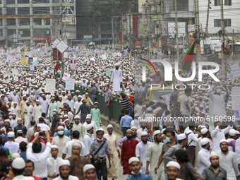 Supporters and activists of the Hefazat-e-Islam Bangladesh, an islamist political party, march towards a French embassy as they take part in...