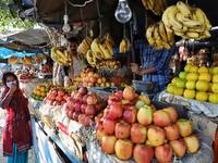 A woman wearing a mask purchases Fruits on the outskirts of Jammu City, Jammu and Kashmir, India on 01 November 2020 amid Covid-19 Coronavir...