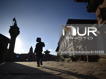 A Little kid playing around the Bhaktapur Durbar Square premises, Bhaktapur, Nepal on November 03, 2020. (