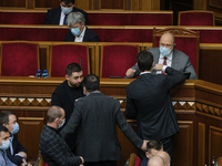 Prime minister of Ukraine Denys Shmyhal (C) talks to lawmakers after consideration of draft budget during the session of Verkhovna Rada in K...