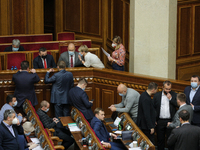 Prime minister of Ukraine Denys Shmyhal talks to lawmakers after consideration of draft budget during the session of Verkhovna Rada in Kyiv,...