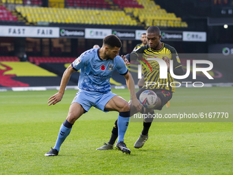 Maxime Biamou of Coventry City and Christian Kabasele of Watford during the Sky Bet Championship match between Watford and Coventry City at...