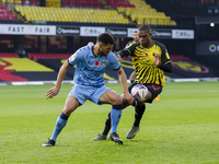 Maxime Biamou of Coventry City and Christian Kabasele of Watford during the Sky Bet Championship match between Watford and Coventry City at...